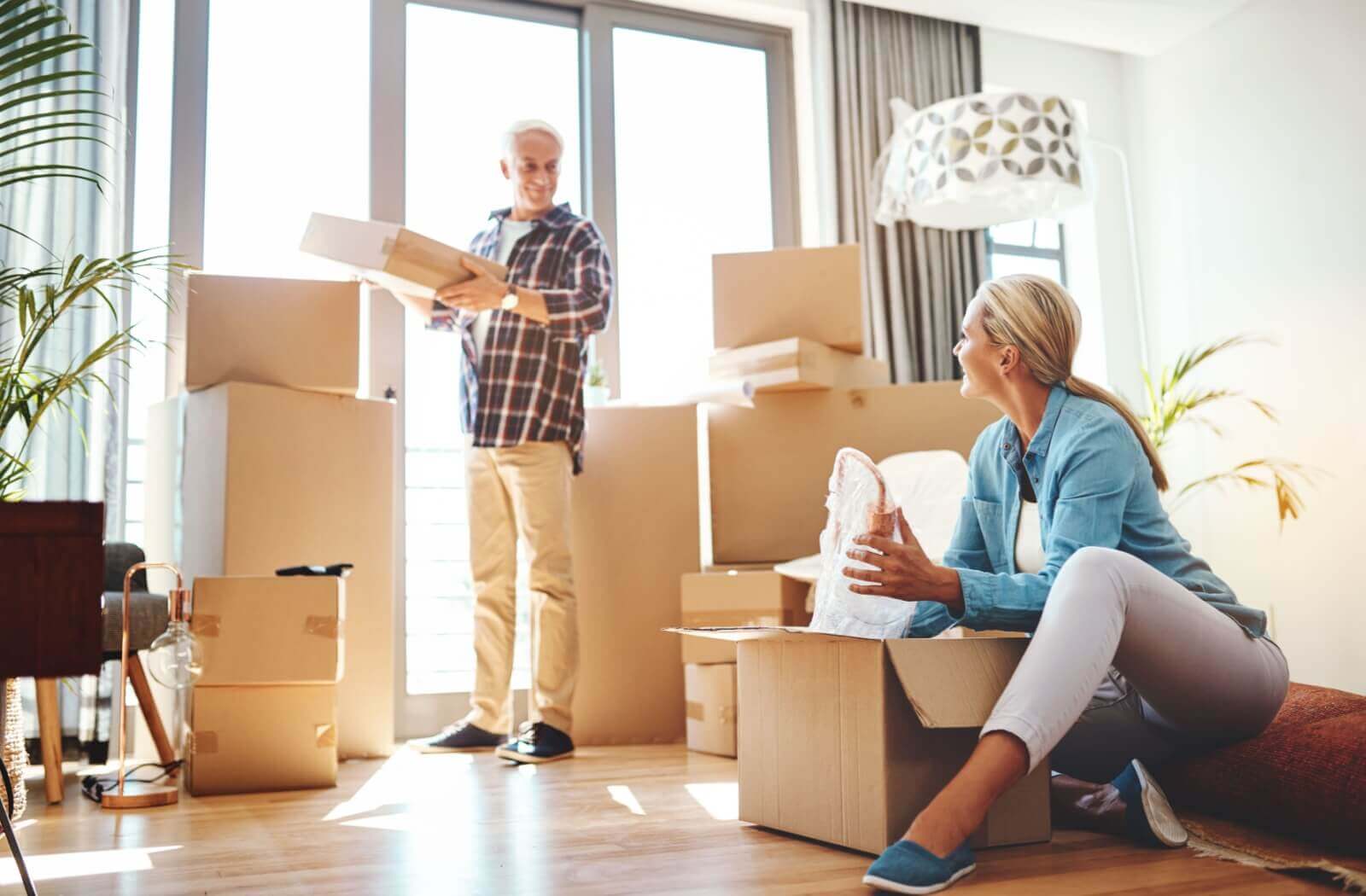 An older adult and his daughter arranging his new personal home care apartment.